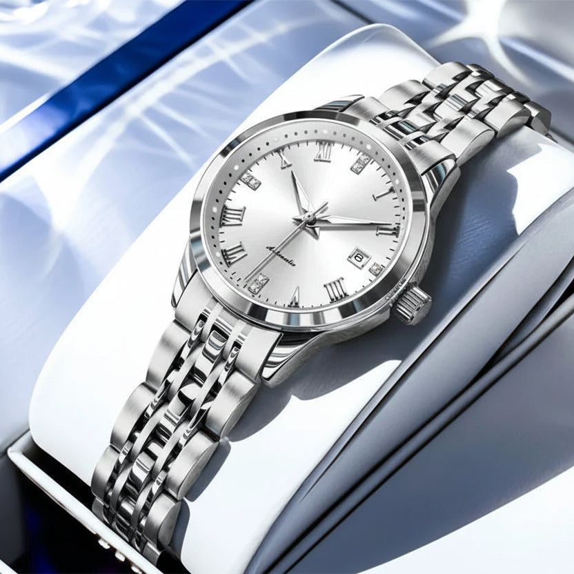 Silver wristwatch with white dial on a reflective surface, featuring the OLEVS brand.