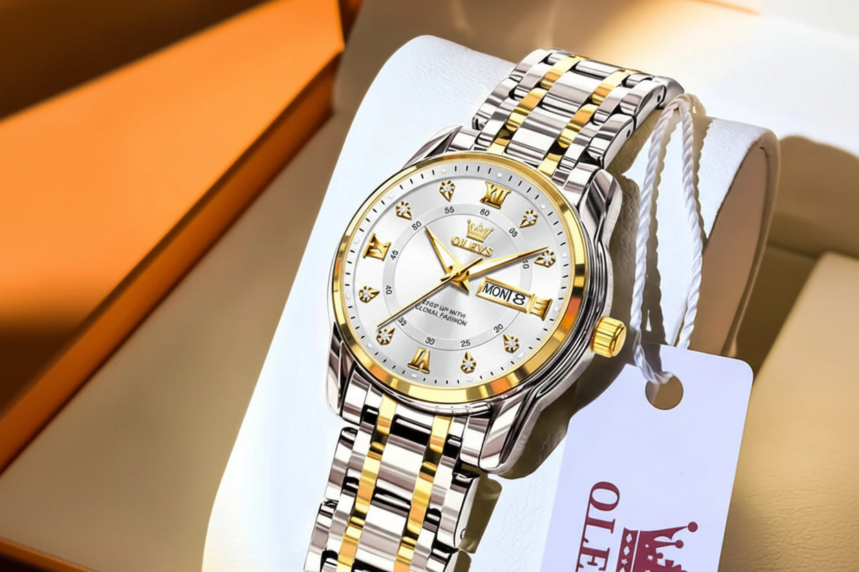 Silver and gold watch with OLEVS branding on a white background