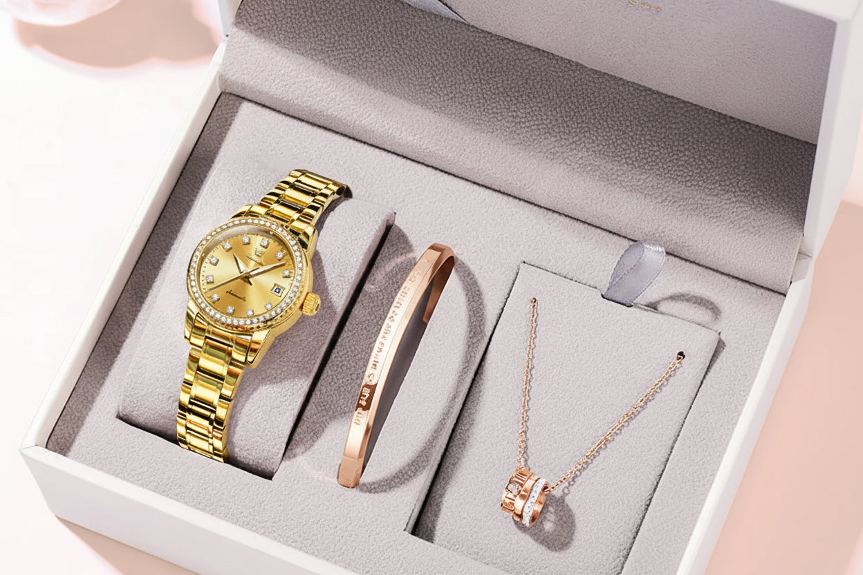 Gold watch, bracelet, and necklace set in a box with OLEVS branding.