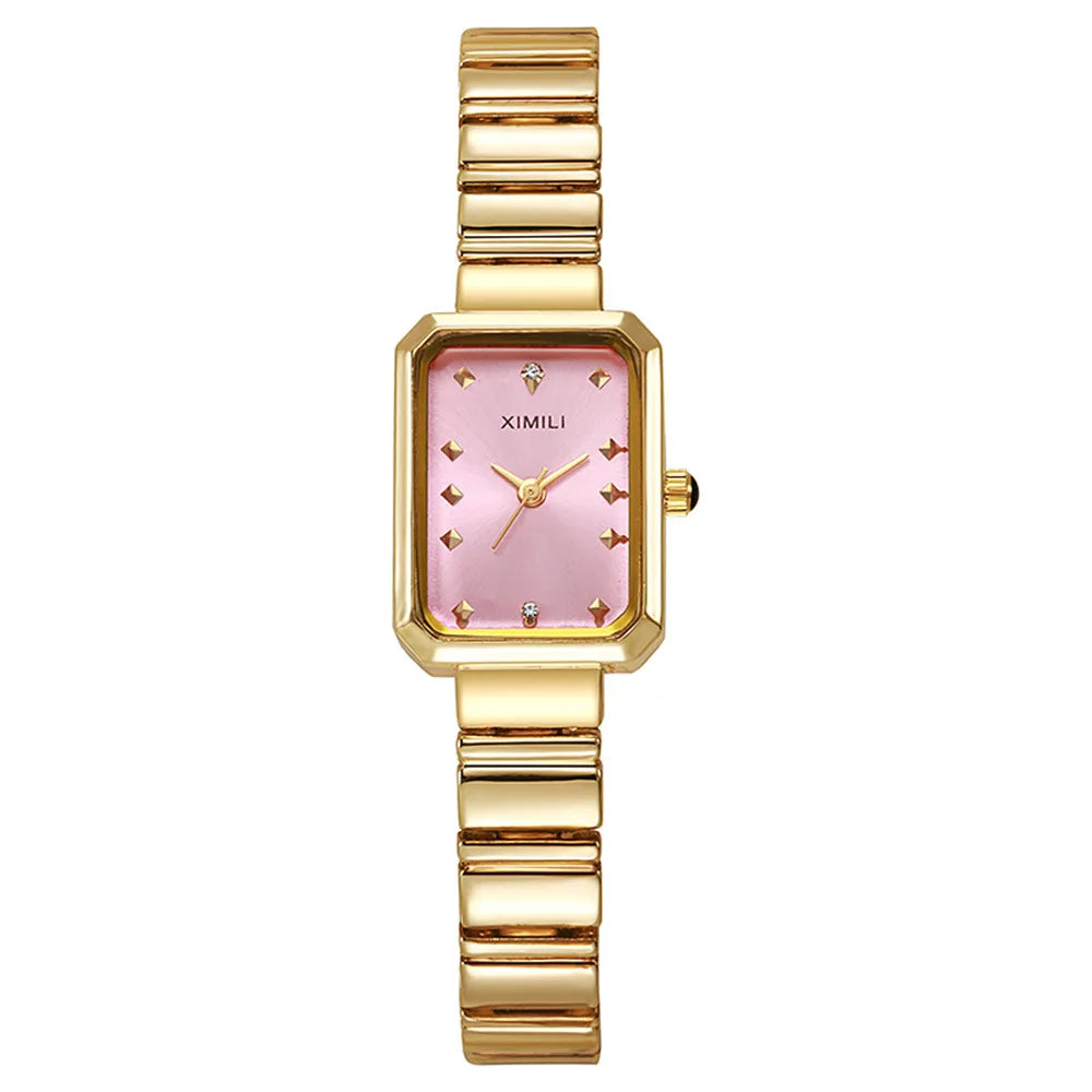 Gold watch with pink face on a white background